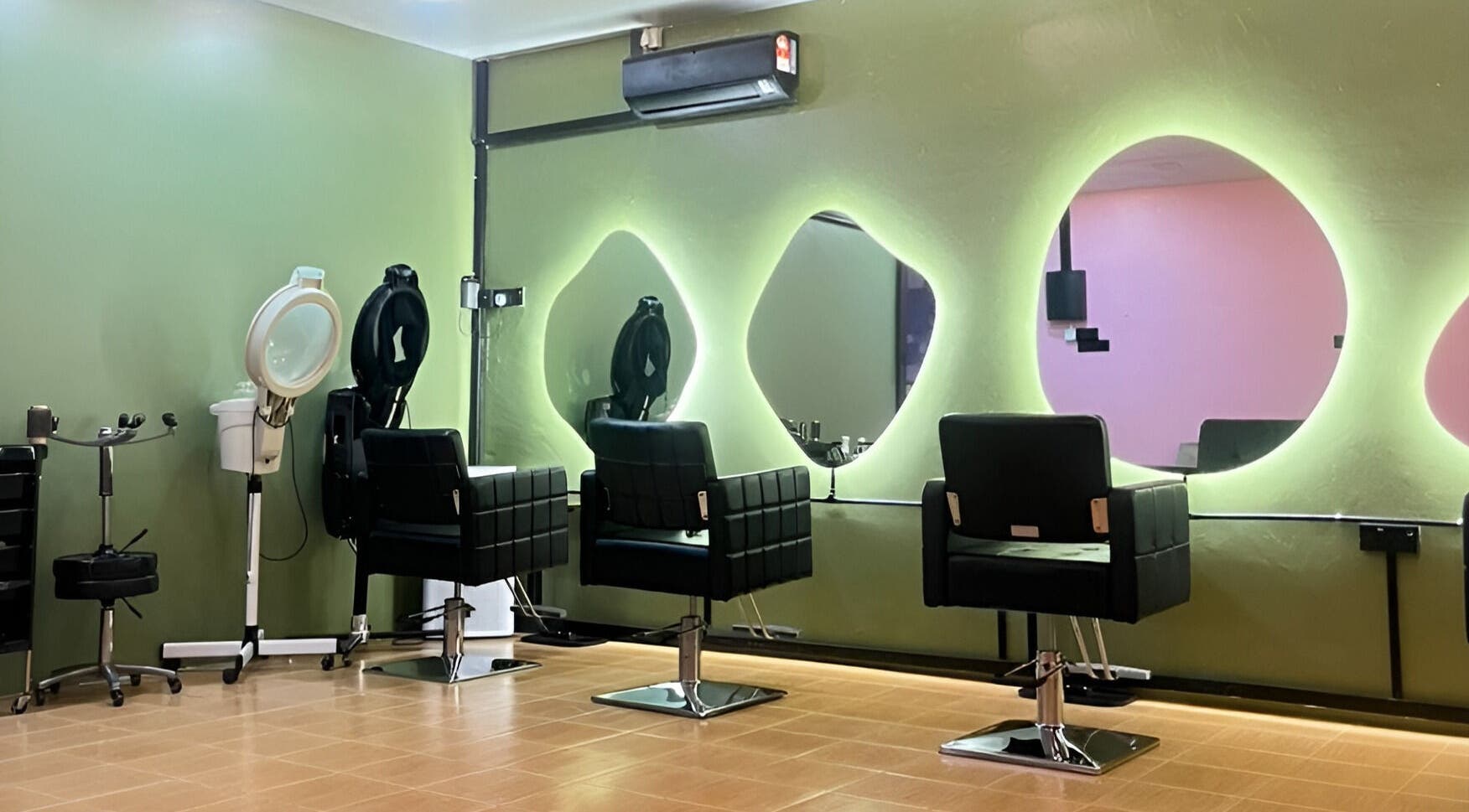 Elegant interior of Myfa Salon Indera Makhota 15, Indera Mahkota, Pahang, MY featuring modern chairs and mirrors.