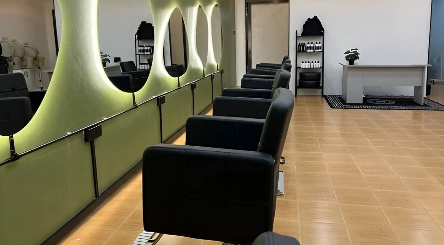 Chic interior of Myfa Salon Indera Makhota 15, Indera Mahkota, Pahang, MY with modern chairs and mirrors.