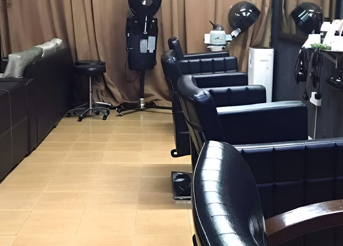 Modern chairs at Myfa Salon Indera Makhota 15 in Indera Mahkota, Pahang, MY, showcasing a chic salon interior.