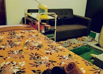 Relaxing treatment room at Myfa Salon Muslimah Bandar Kuantan, Pahang, MY with floral decor and comfortable seating.