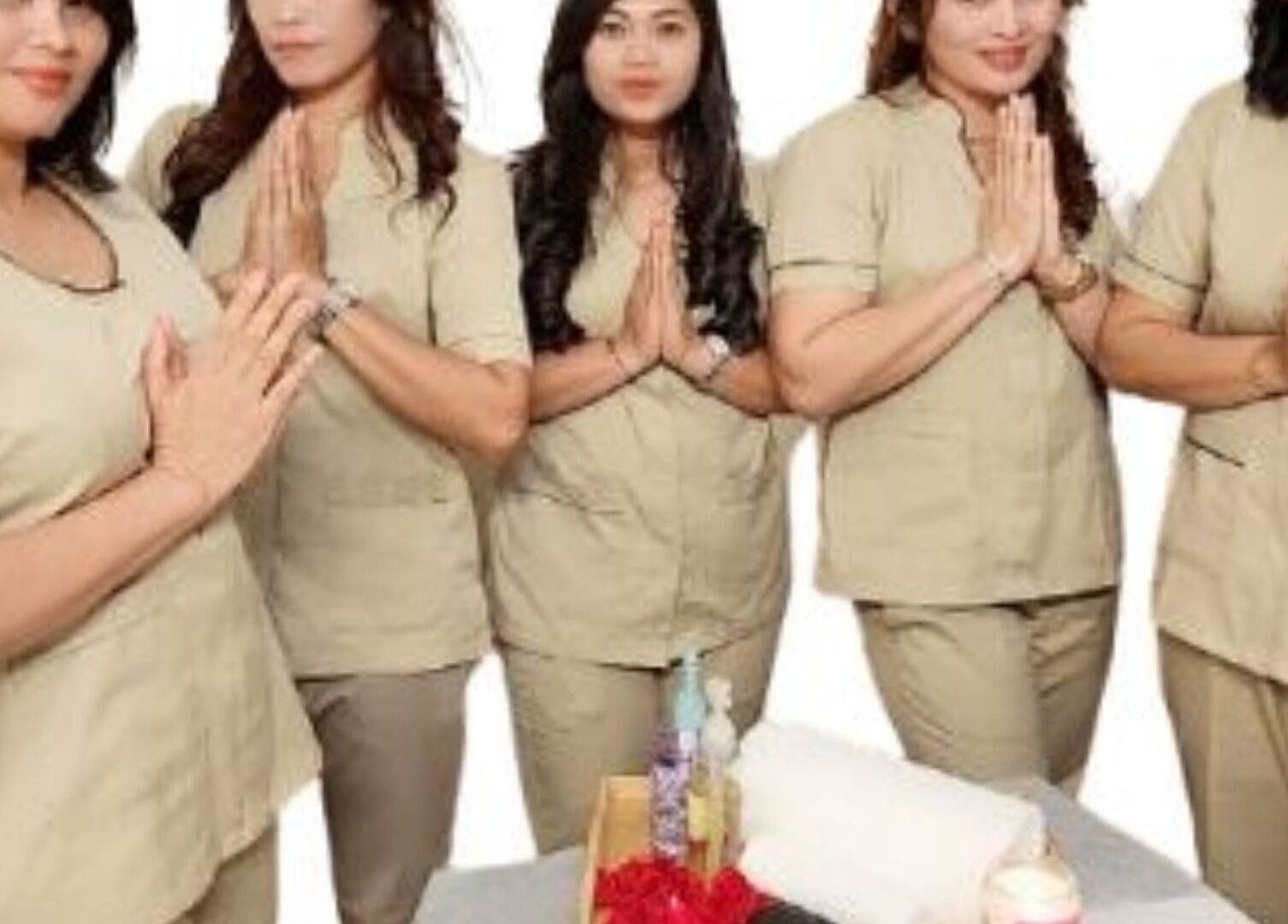 Staff at Anugrah Bali Spa Home, Office and Events in Dubai, AE greet clients with a welcoming gesture.