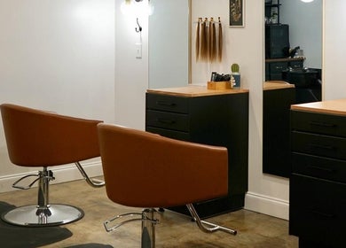 Elegant salon setup with chic chairs at Unorthodox Salon, Taylors, South Carolina, US.