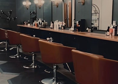 Elegant salon chairs at Unorthodox Salon in Taylors, South Carolina, US, showcasing a stylish interior.