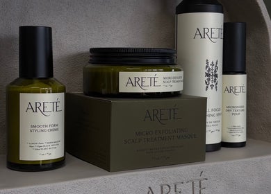 Areté hair products at Unorthodox Salon in Taylors, South Carolina, US, displayed on a sleek shelf.