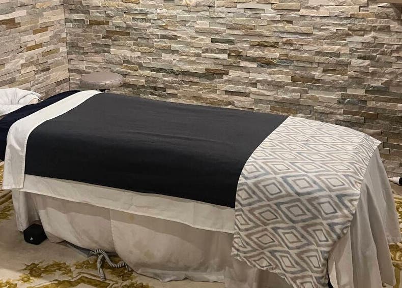 Relaxing massage room at Edelweiss Day Spa, Kosciuszko National Park, New South Wales, AU - stone walls add calm.