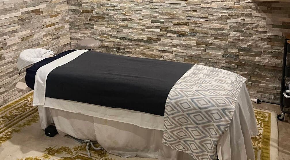 Relaxing massage room at Edelweiss Day Spa, Kosciuszko National Park, New South Wales, AU - stone walls add calm.