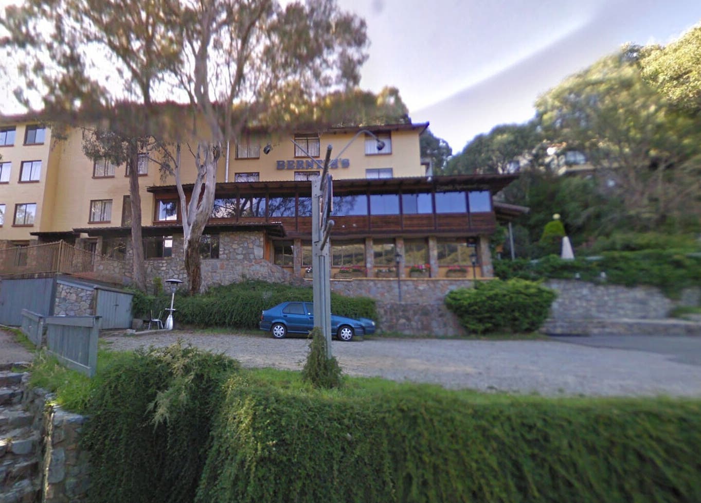Exterior view of Edelweiss Day Spa nestled in lush greens, Kosciuszko National Park, New South Wales, AU.