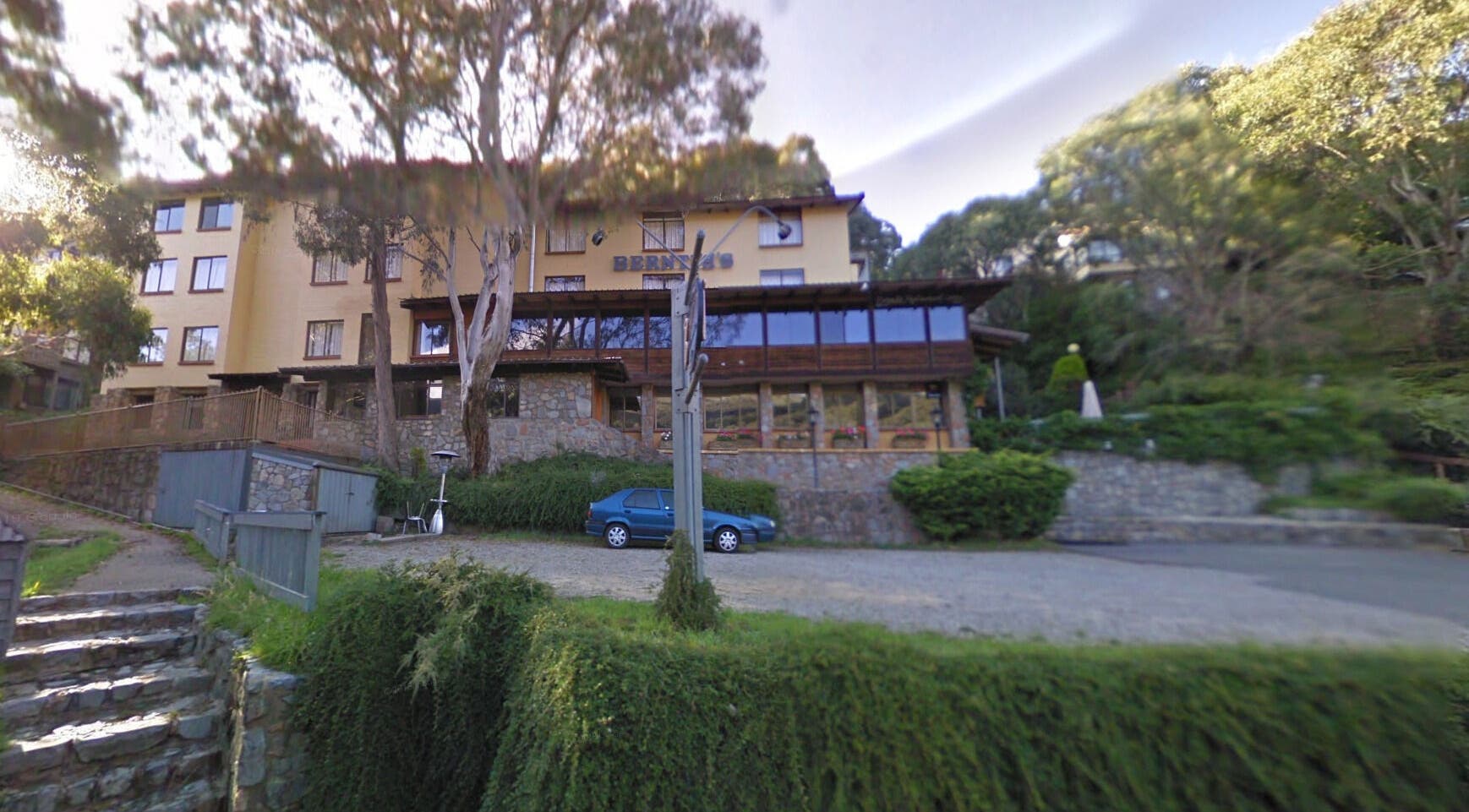 Exterior view of Edelweiss Day Spa nestled in lush greens, Kosciuszko National Park, New South Wales, AU.