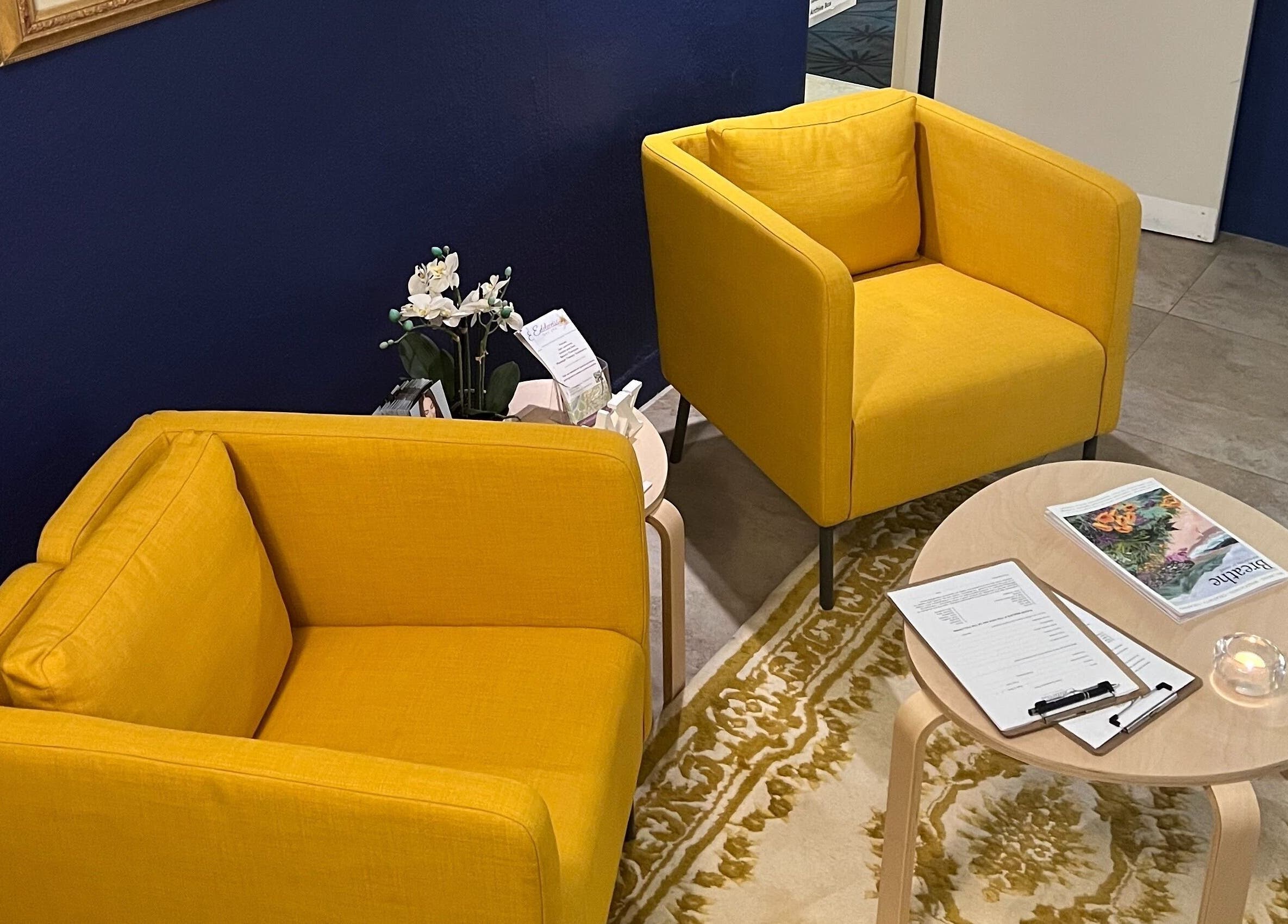 Bright yellow chairs in waiting area at Edelweiss Day Spa, Kosciuszko National Park, New South Wales, AU.