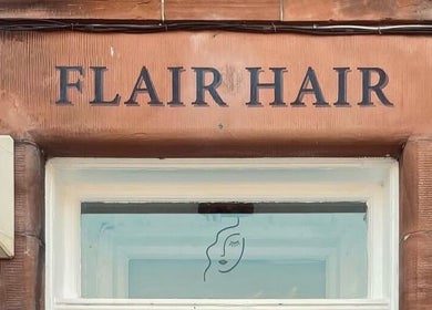 Front sign of Flair Hair in Peebles, Scotland, GB showcasing its elegant exterior design.