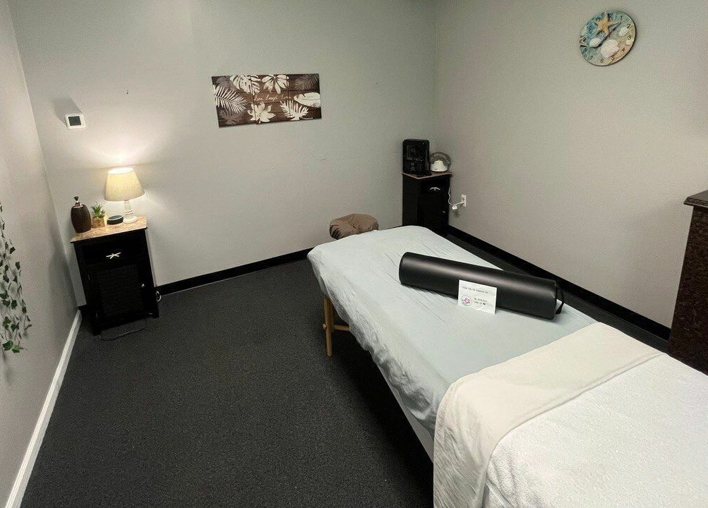 Tranquil massage room at Tropical Touch Spa Walled Lake, Walled Lake, Michigan, US with calming decor.