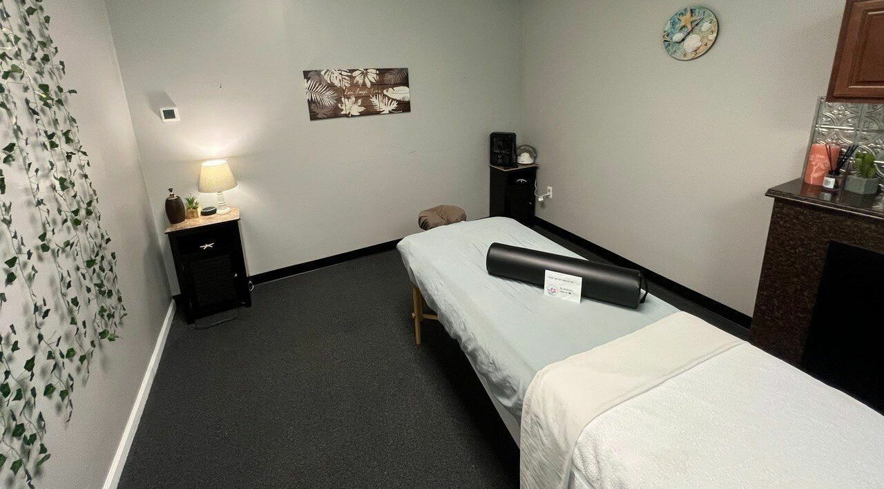 Tranquil massage room at Tropical Touch Spa Walled Lake, Walled Lake, Michigan, US with calming decor.