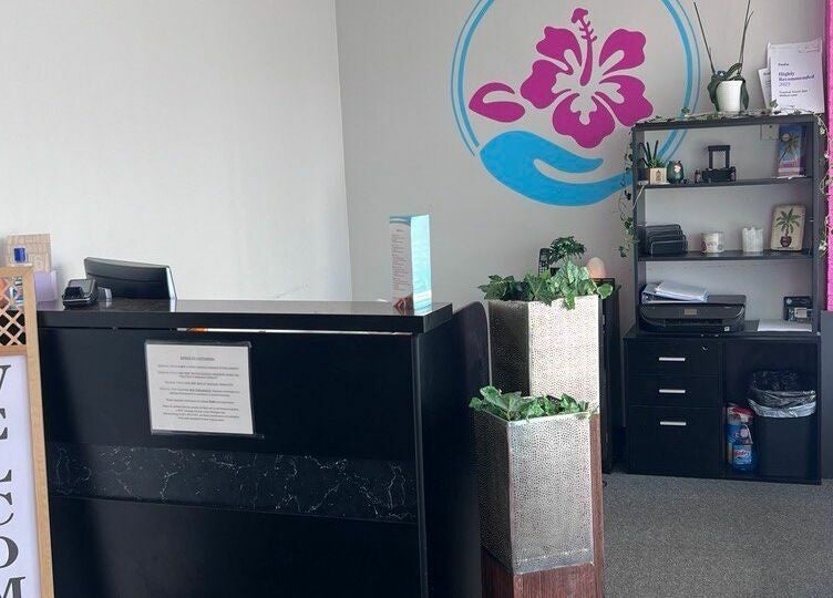 Reception area at Tropical Touch Spa Walled Lake, Walled Lake, Michigan, US with vibrant decor.