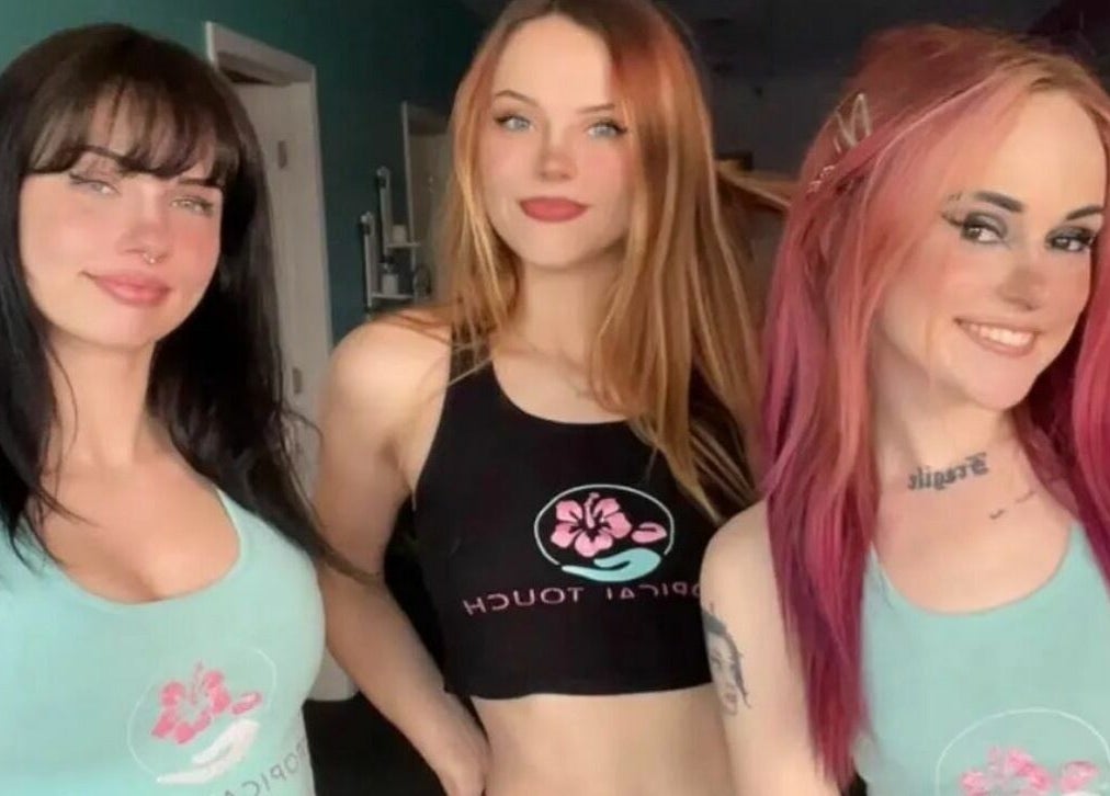 Team members smiling at Tropical Touch Spa Walled Lake, enhancing the vibrant atmosphere in Walled Lake, Michigan, US.