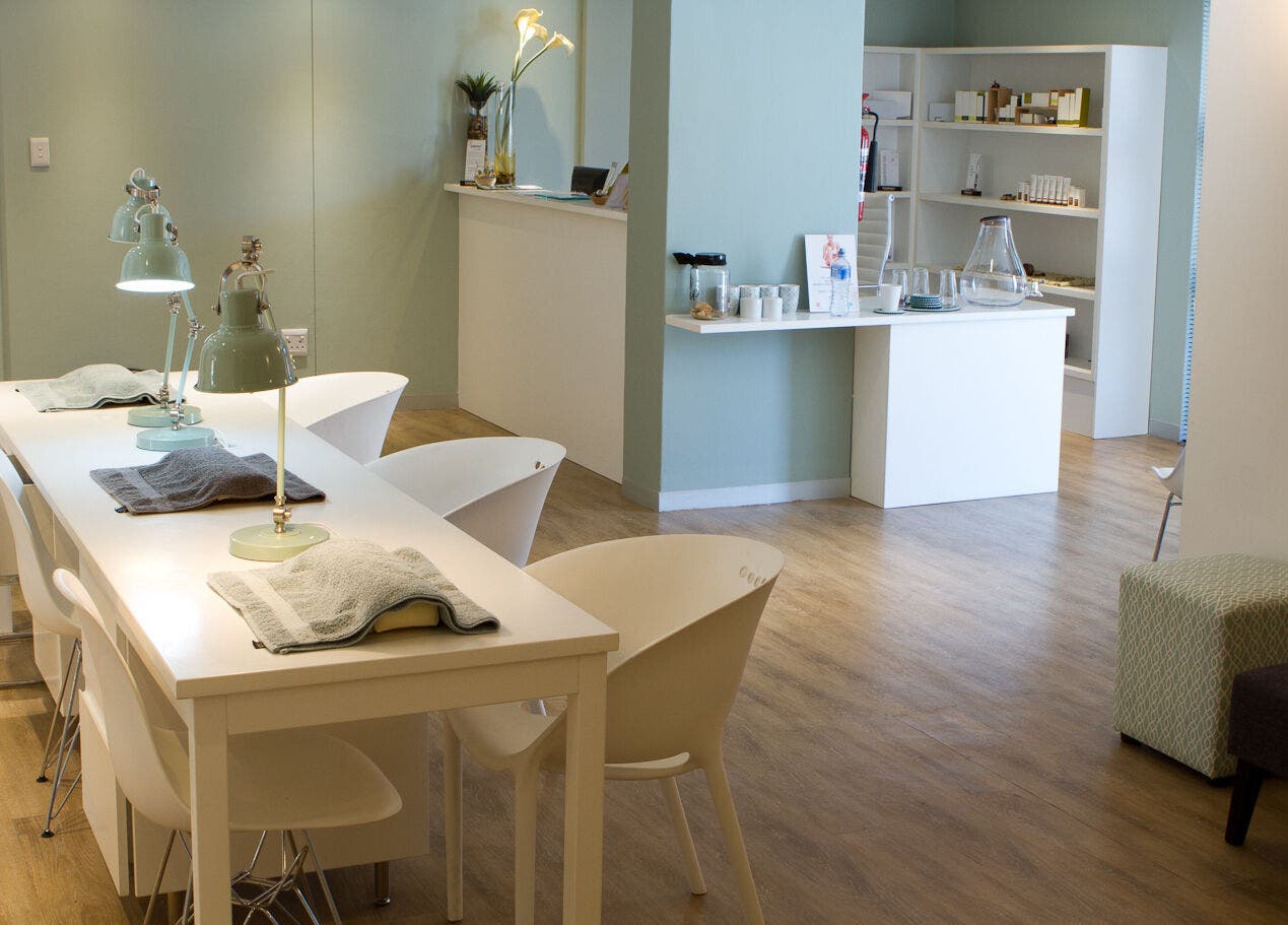 Calm, elegant interior of Origin Wellness Spa, Cape Town, Western Cape, ZA. Modern decor and ambient lighting.