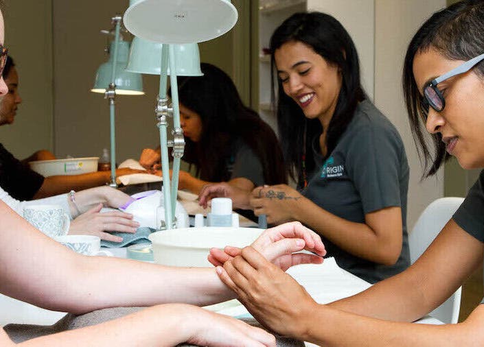 Clients receiving hand massage at Origin Wellness Spa, Cape Town, Western Cape, ZA.