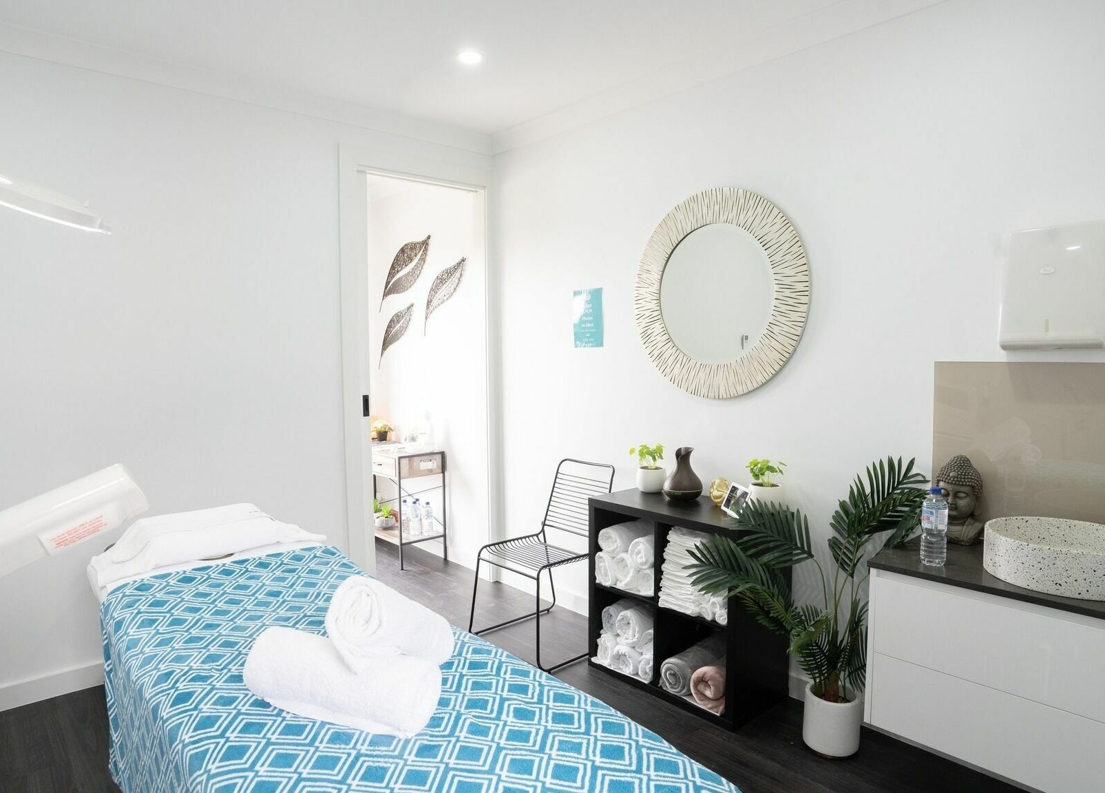 Calm treatment room at I Glow Skin Spa in Burnside, Victoria, AU, featuring cozy bed and soothing decor.
