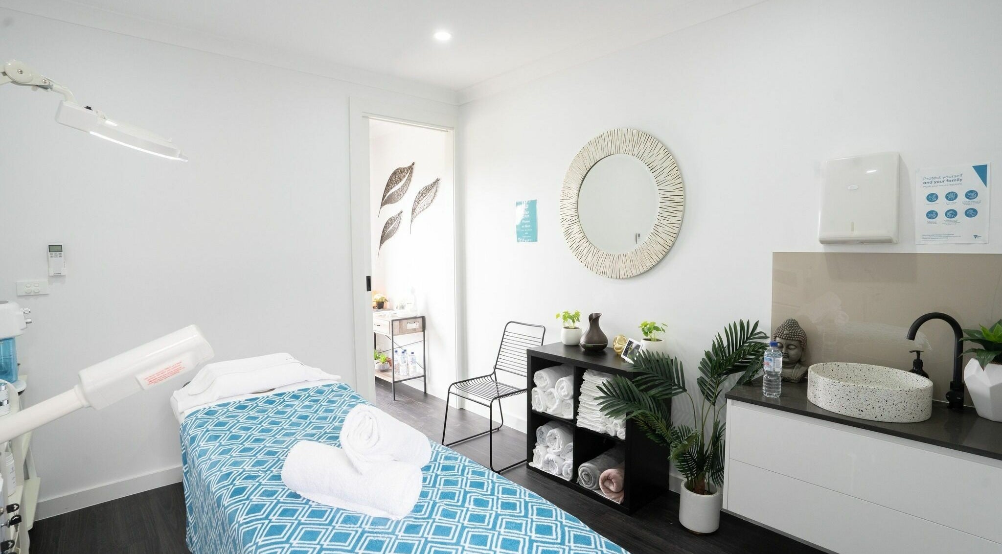 Calm treatment room at I Glow Skin Spa in Burnside, Victoria, AU, featuring cozy bed and soothing decor.