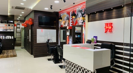 Jawed Habib Hair and Beauty - Sindhu Bhavan Road in Ahmedabad, Gujarat, IN. Modern salon interior with styling stations.