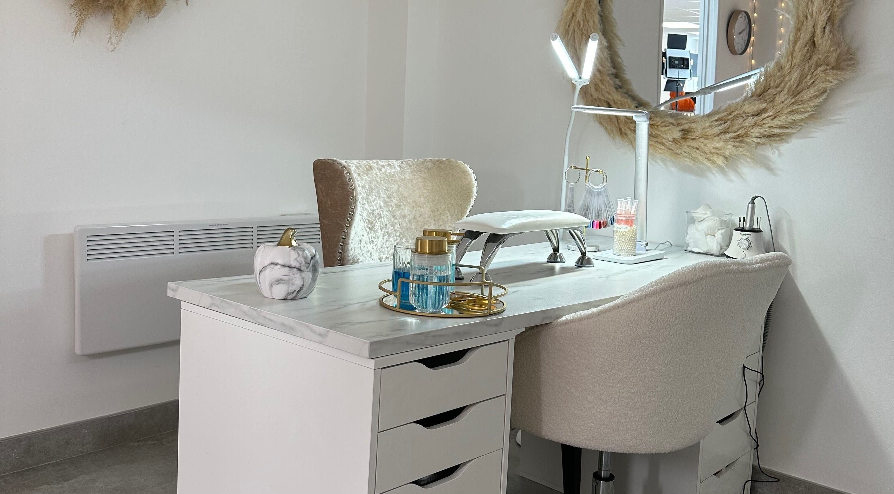 Elegant nail service desk at Beauty By Hattie, Kiveton Park, England, GB with modern décor and plush seating.