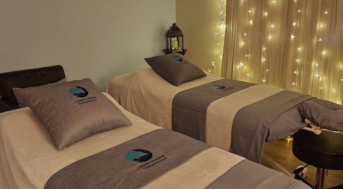 Relaxing massage beds at I Wanna Massage Therapeutics, Fort McMurray, Alberta, CA with soft lighting.