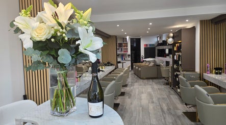 Chic interior of The Retreat@23/ Victoria Perkins Hairdressing in Knutsford, England with floral elegance.