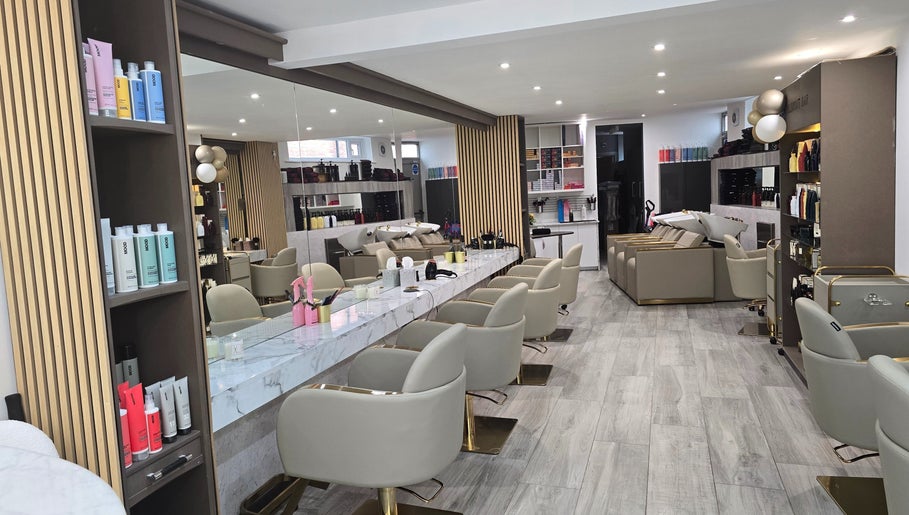 Chic interior of The Retreat@23/ Victoria Perkins Hairdressing in Knutsford, England, featuring modern styling stations.