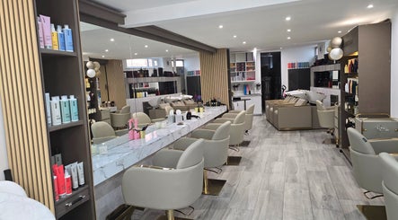 Chic interior of The Retreat@23/ Victoria Perkins Hairdressing in Knutsford, England, featuring modern styling stations.