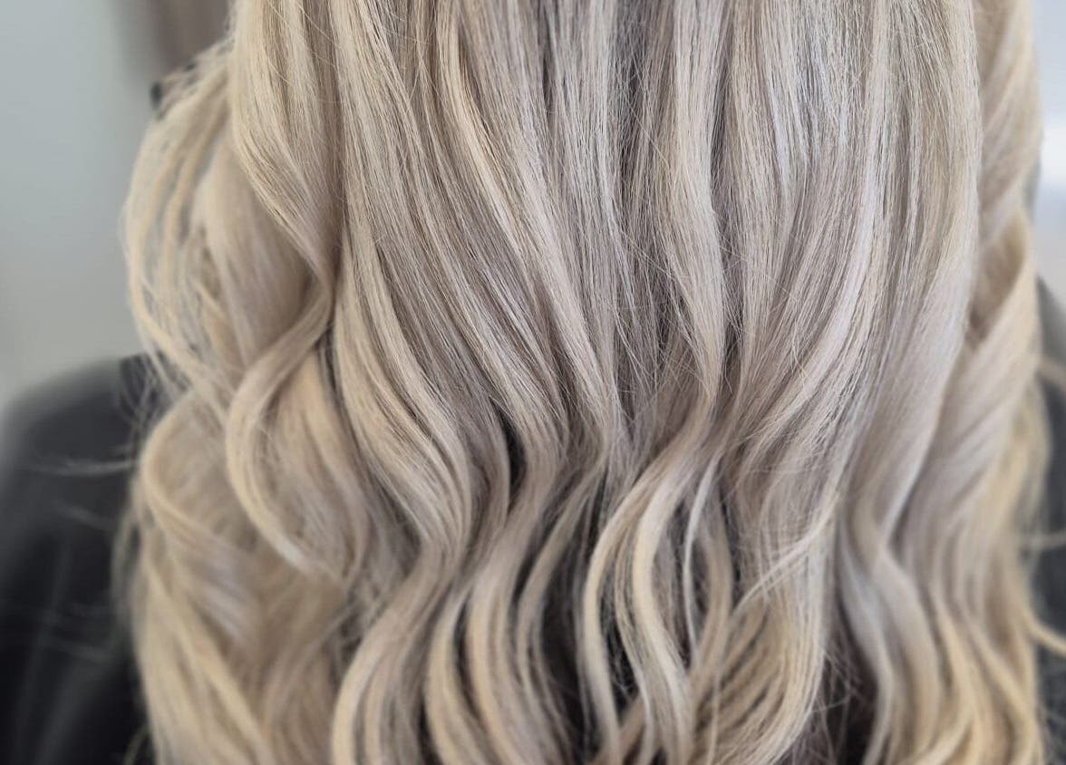 Blonde wavy hair styled at By Keeley, Leicester, England, GB for a glamorous look.