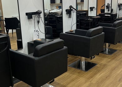 Modern salon chairs at The Hair Edit in Manchester, England, GB showcasing a sleek interior design.