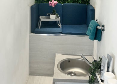 Cozy seating area with blue cushions at Beauty with Sammie, Coventry, England, GB.
