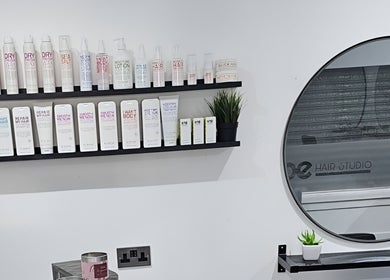 Product shelves at Joanne Slattery Hair, Hope Hair Studio, Blackburn, Scotland, GB showcase high-end hair care.