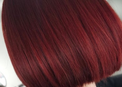 Vibrant red bob haircut at Joanne Slattery Hair at Hope Hair Studio, Blackburn, Scotland, GB.
