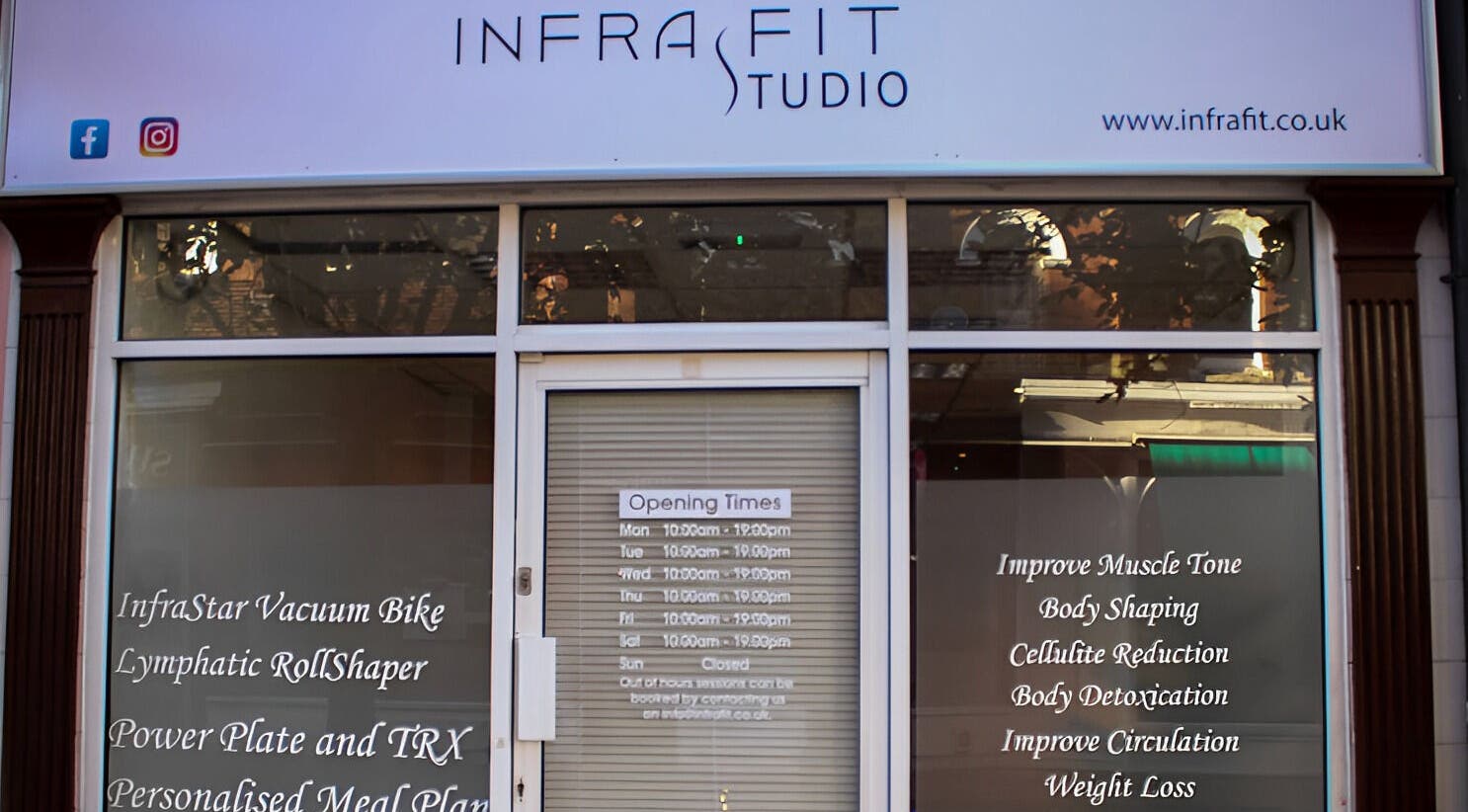 Front view of InfraFit Studio in Rugby, England, GB with service offerings listed on the window.