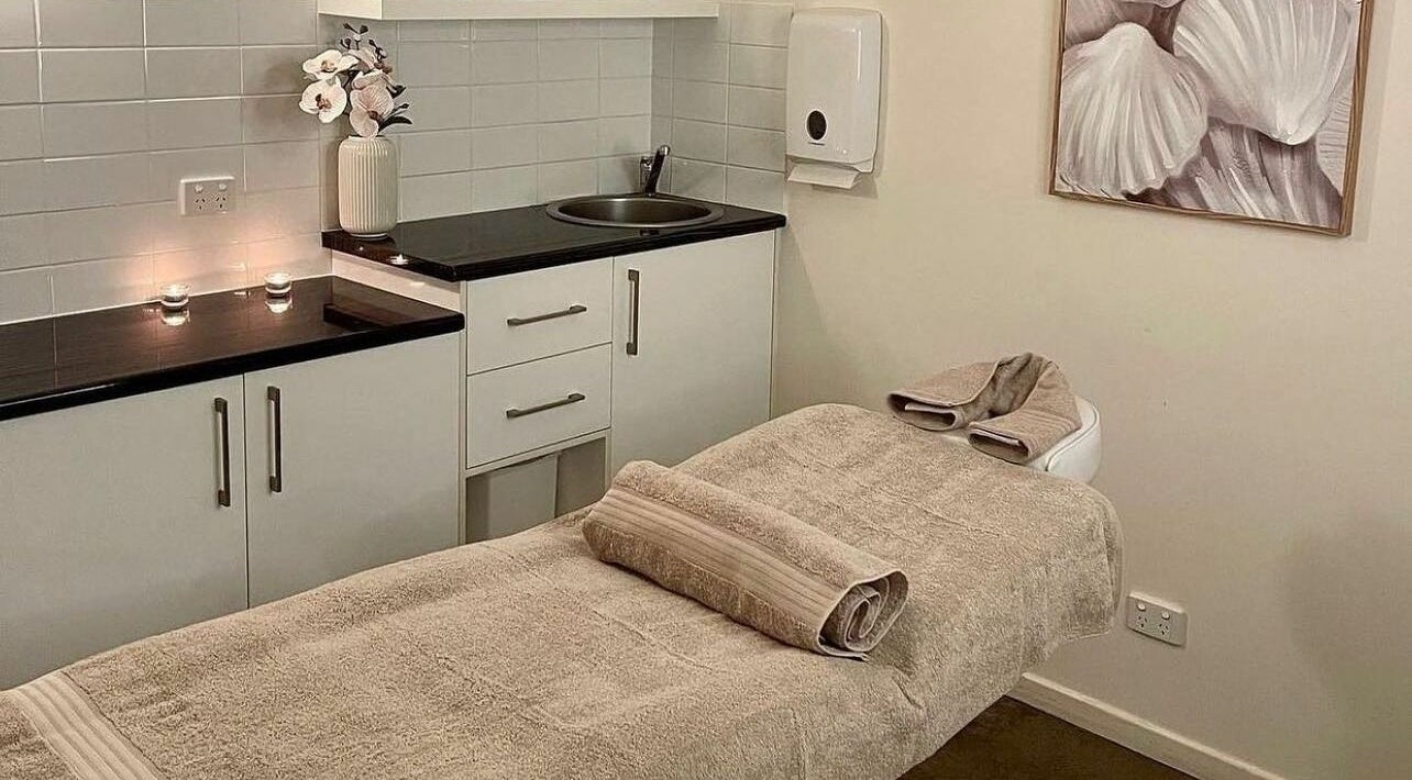 Relaxing massage room at Marlo Lane Beauty, Burleigh Heads, Queensland, AU, featuring a cozy treatment table.