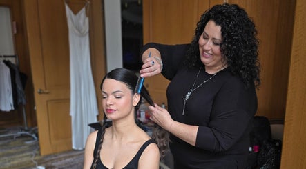 Stylist creating a braided hairstyle at Wel-Don Hair Makeup and Weddings in Andover, Massachusetts, US.
