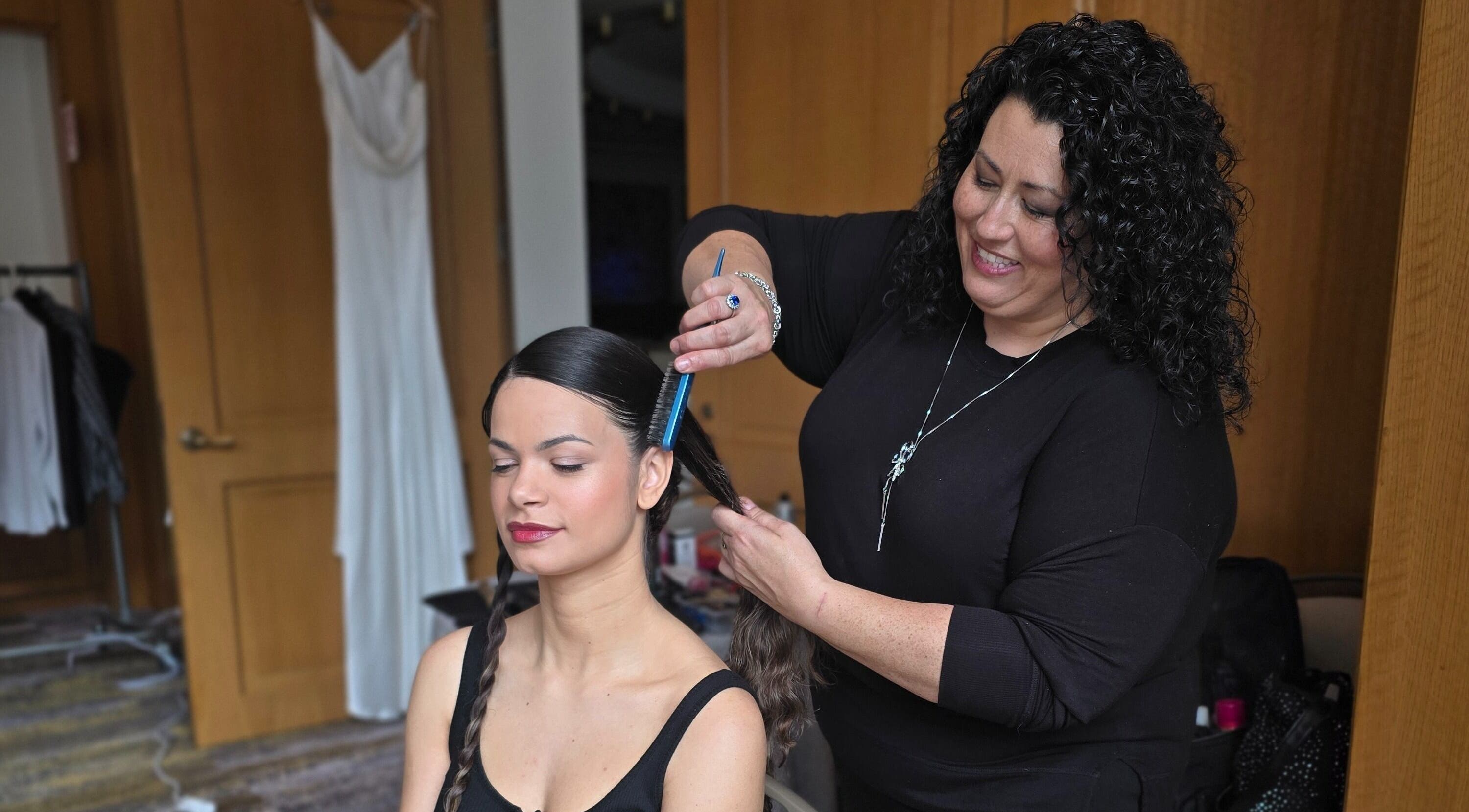 Stylist at Wel-Don Hair Makeup and Weddings in Andover, Massachusetts, US, creating elegant hairstyle.