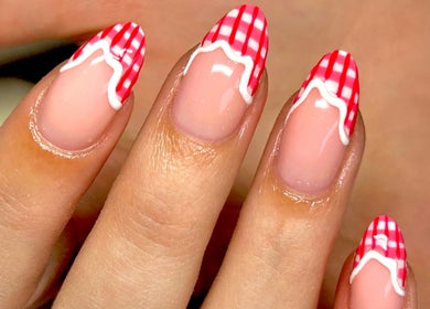 Stylish red and white nail art at Radiance By Becca, Halifax, England, GB for chic beauty.