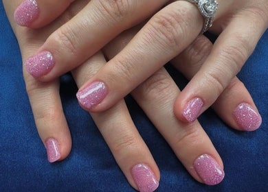 Sparkling pink nails designed at Radiance By Becca, Halifax, England, GB, showcasing elegance and style.