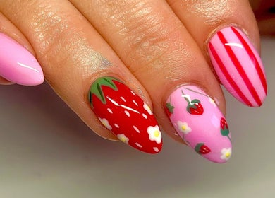 Strawberry-themed nail art at Radiance By Becca in Halifax, England, GB. Vibrant pink and red designs.