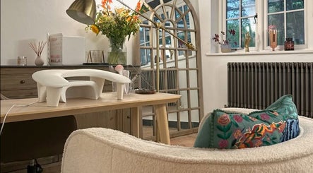 Cozy treatment area at Sulking Room Studio, Horsham, England, GB, featuring stylish decor and comfortable seating.