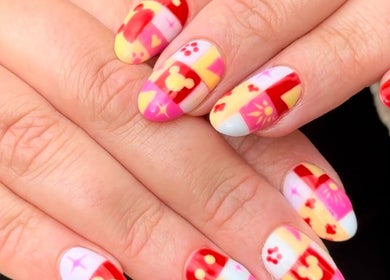 Colorful nail art at Sulking Room Studio, Horsham, England, GB. Intricate patterns create a unique look.
