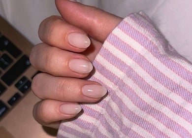 Close-up of a polished manicure at Sulking Room Studio, Horsham, England, GB, showcasing delicate nail art.