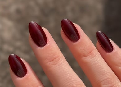 Elegant garnet nails at Sulking Room Studio, Horsham, England, GB, showcasing precision nail artistry.
