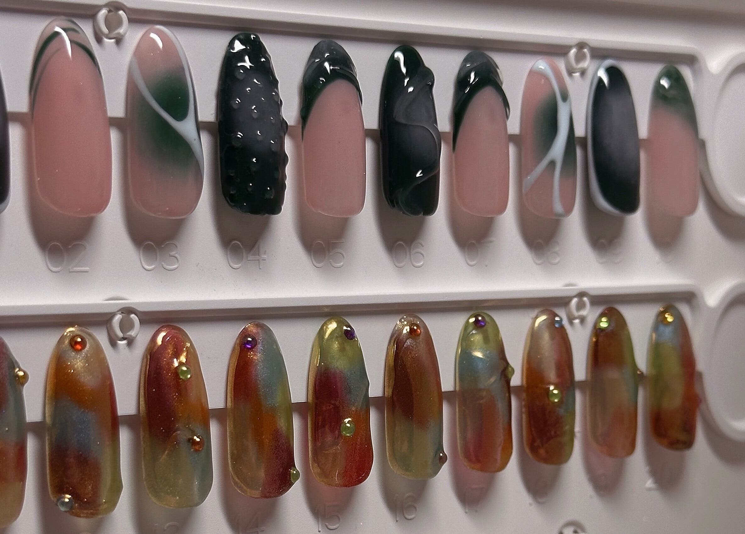 Elegant nail art designs at The Sulking Room, Horsham, England, GB, showcasing unique manicure styles.