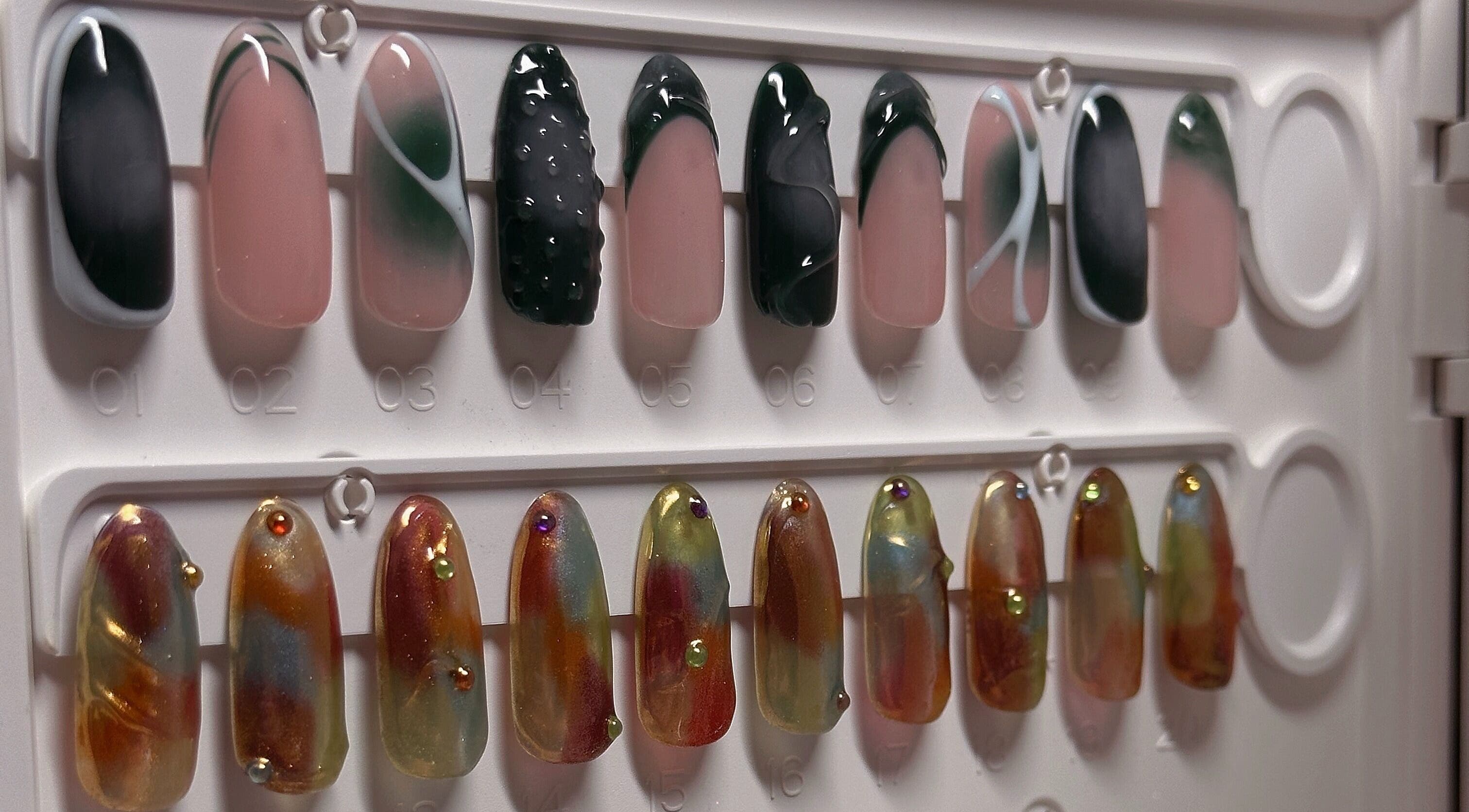 Elegant nail art designs at The Sulking Room, Horsham, England, GB, showcasing unique manicure styles.