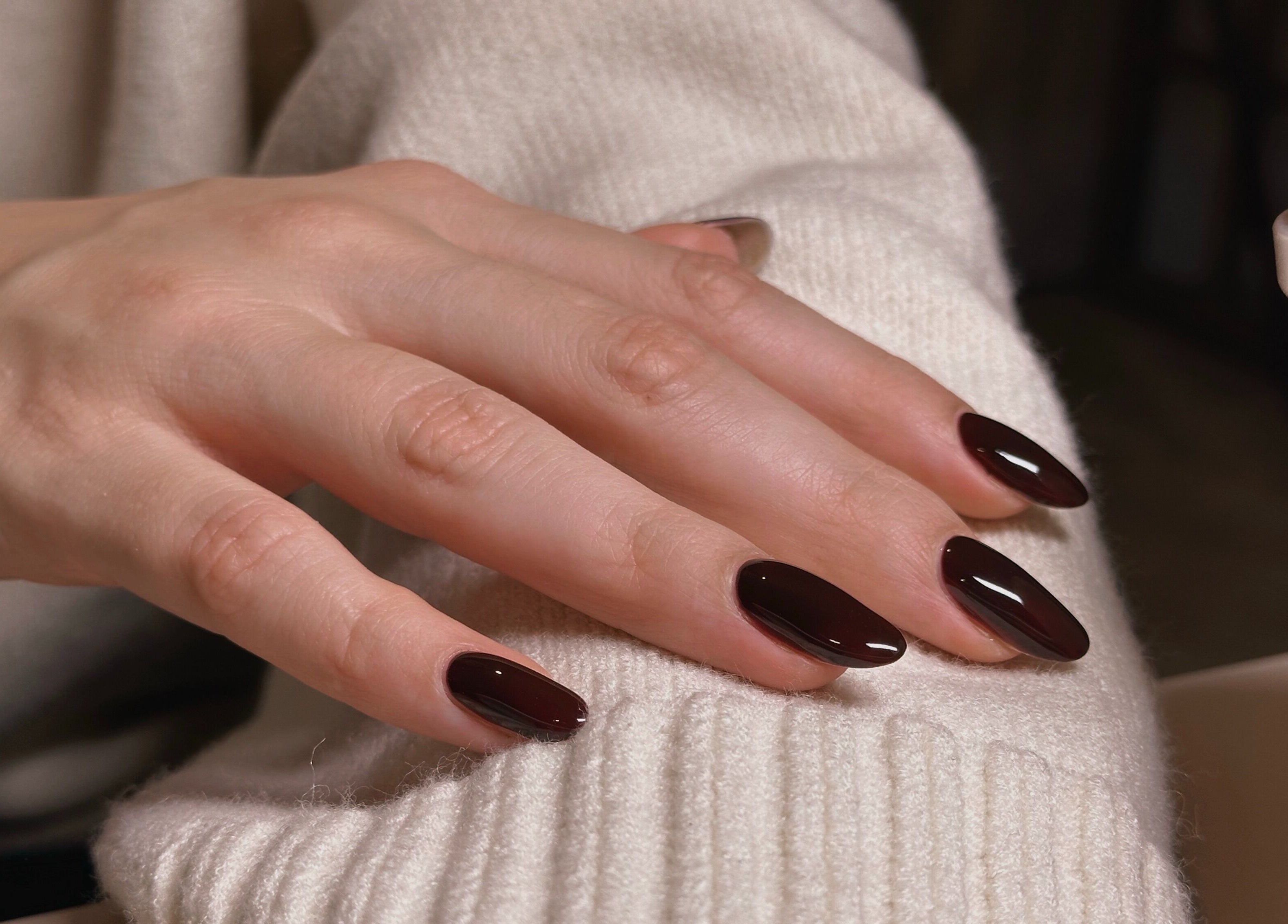 Claret red manicure at The Sulking Room, Horsham, England, GB. Perfectly shaped and glossy finish.