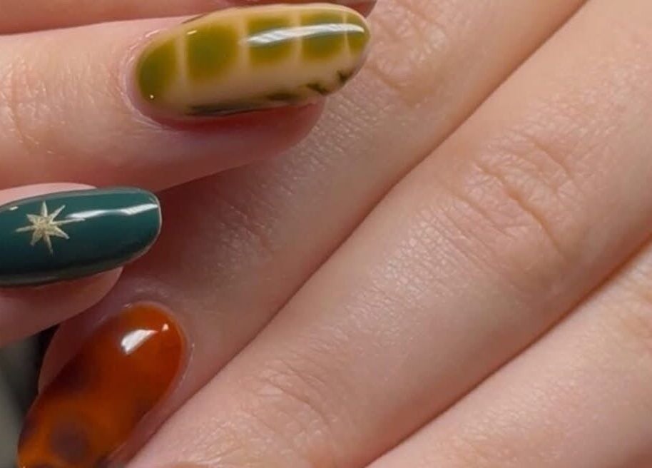 Close-up of artistic nail designs at The Sulking Room, Horsham, England, GB, featuring unique patterns.