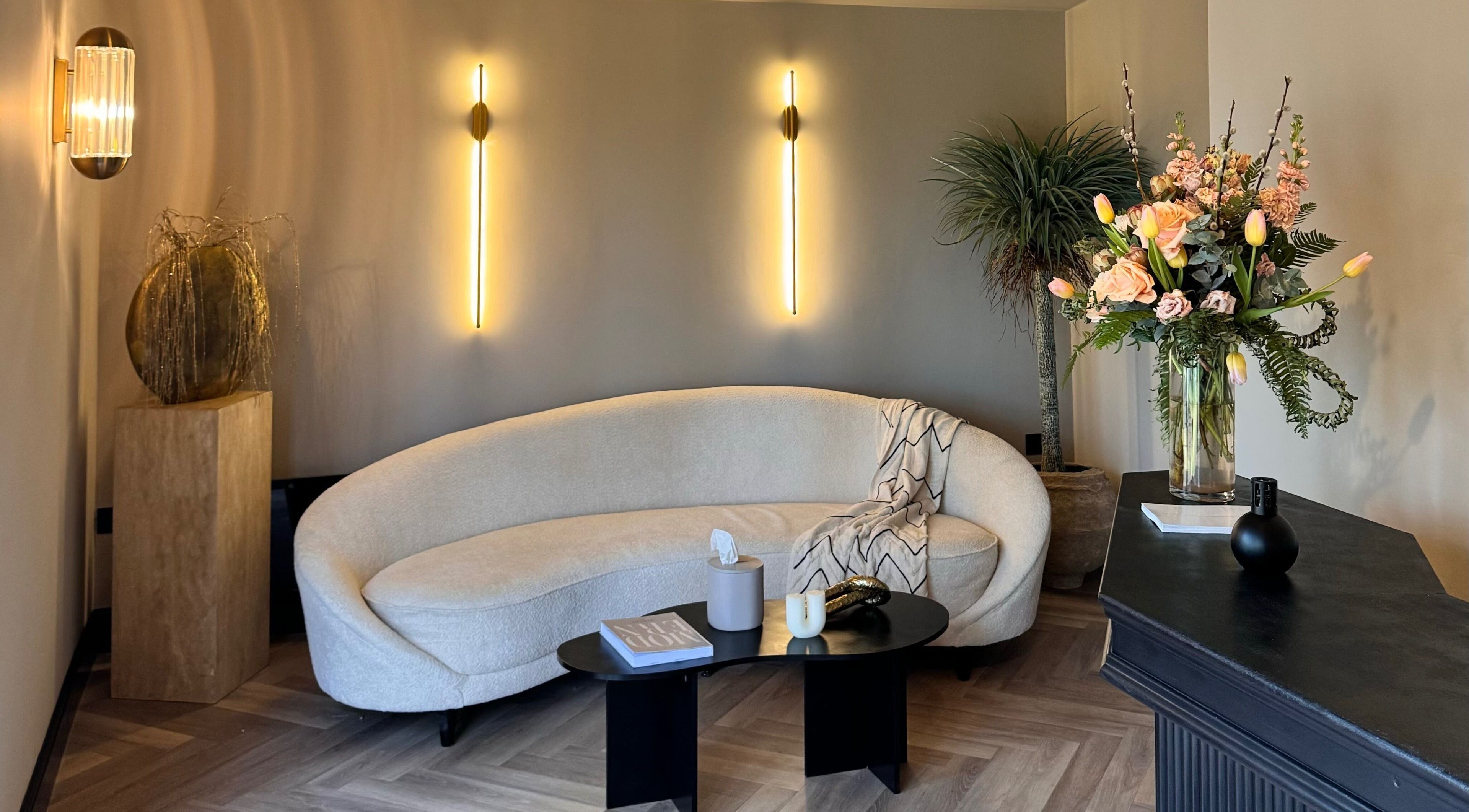 Elegant lounge at Antoinette Aesthetics, East Harling, England, GB with chic decor and ambient lighting.