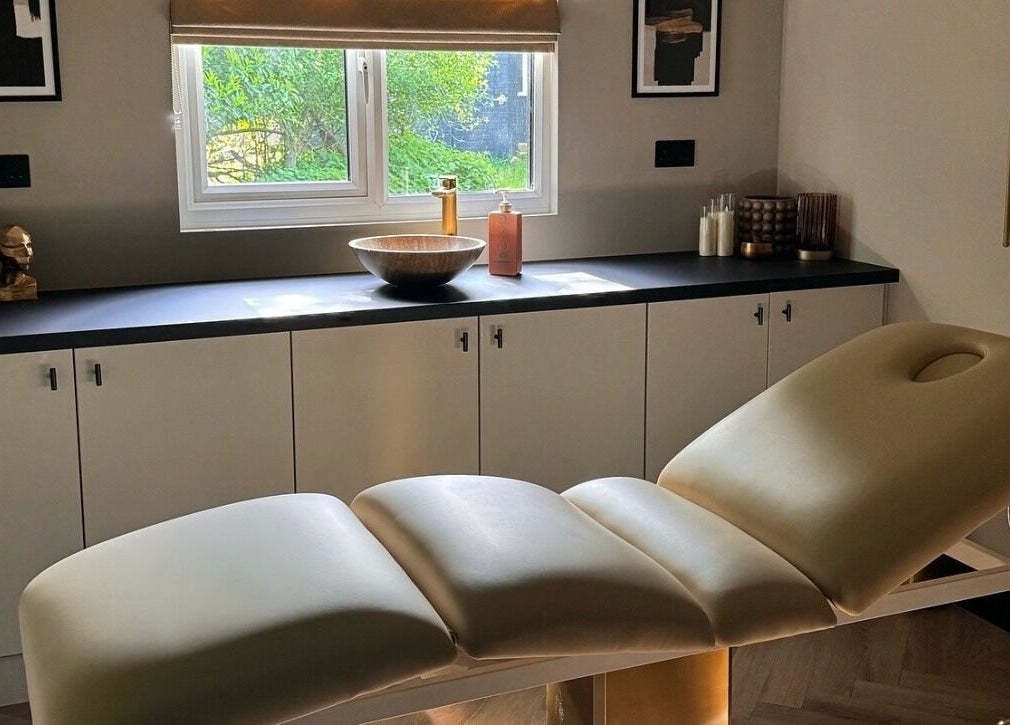 Luxurious treatment room at Antoinette Aesthetics, East Harling, England, GB with massage table and modern decor.